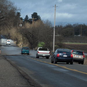 Ambulance crossing flooded Willowside Road